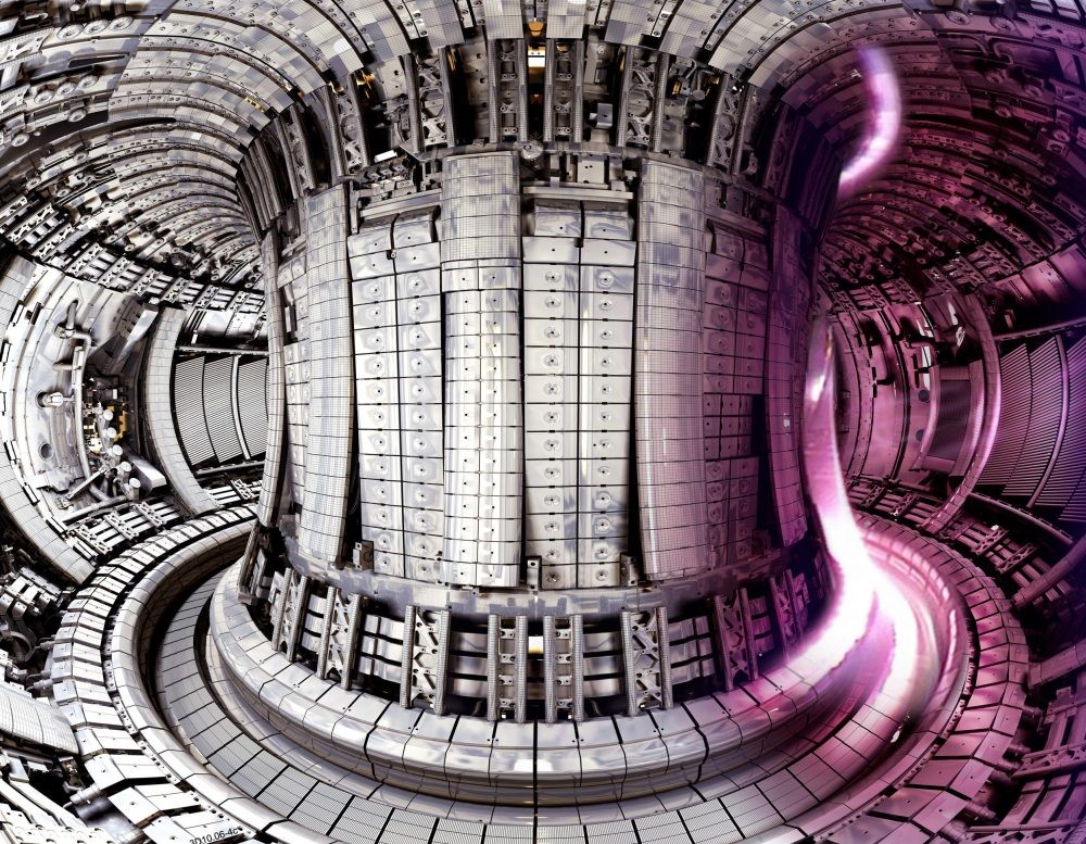 Interior of the JET fusion experiments, showing a fusion plasma (right).  Photo Credit: © EUROfusion